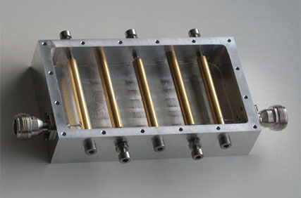 Figure 5 image of a coaxial combline cavity filter with tuning screws 