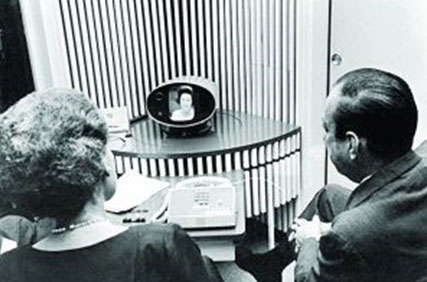 Figure 2 image of former bell telephone president john de butts talking to lady bird johnson 